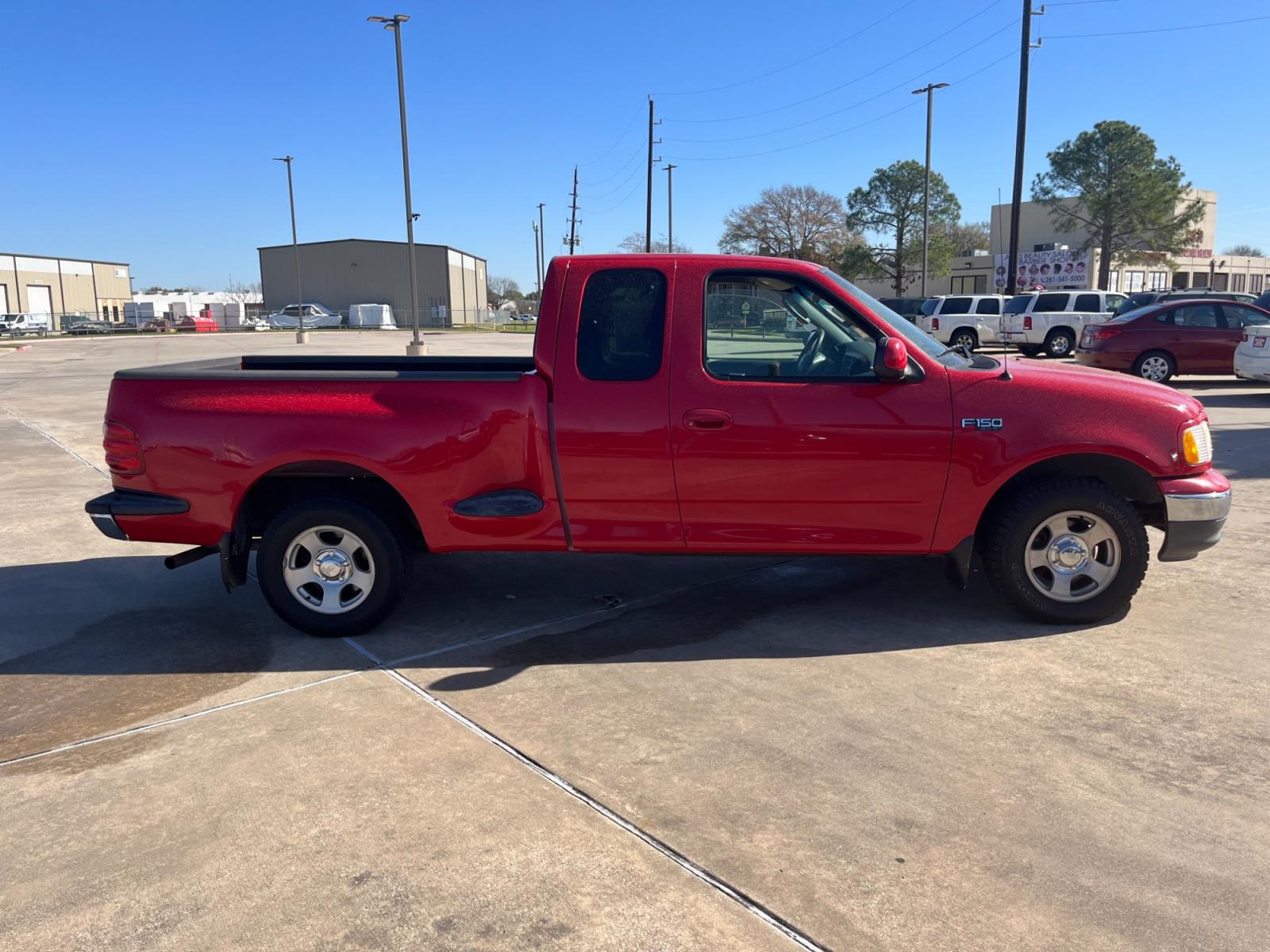 2003 red /TAN Ford F-150 XL SuperCab Flareside 2WD (1FTRX07213K) with an 4.2L V6 OHV 12V engine, Automatic transmission, located at 14700 Tomball Parkway 249, Houston, TX, 77086, (281) 444-2200, 29.928619, -95.504074 - Photo #7